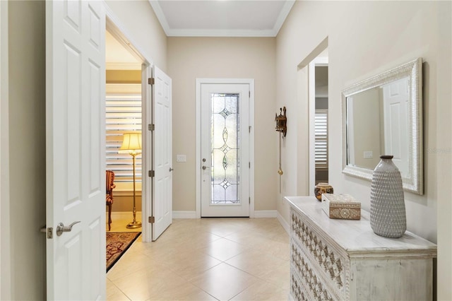 doorway to outside featuring crown molding and light tile patterned floors