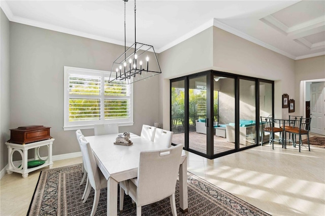 dining area featuring ornamental molding and a notable chandelier