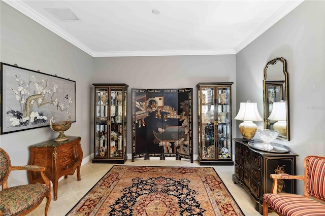 sitting room featuring light tile patterned floors and crown molding