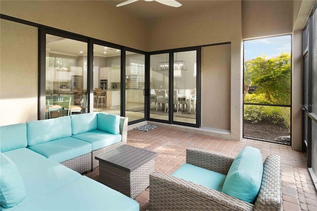 sunroom / solarium with ceiling fan