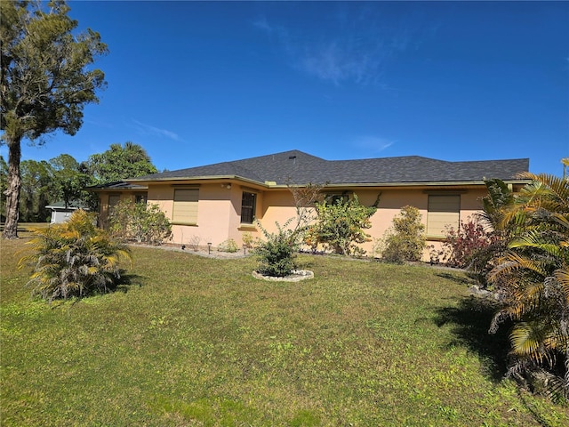 rear view of house with a lawn