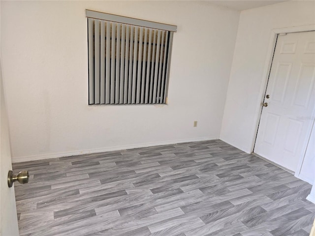 unfurnished room featuring light wood-type flooring