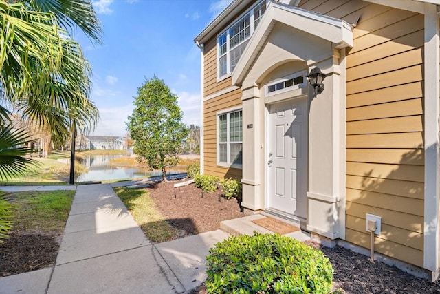 entrance to property with a water view