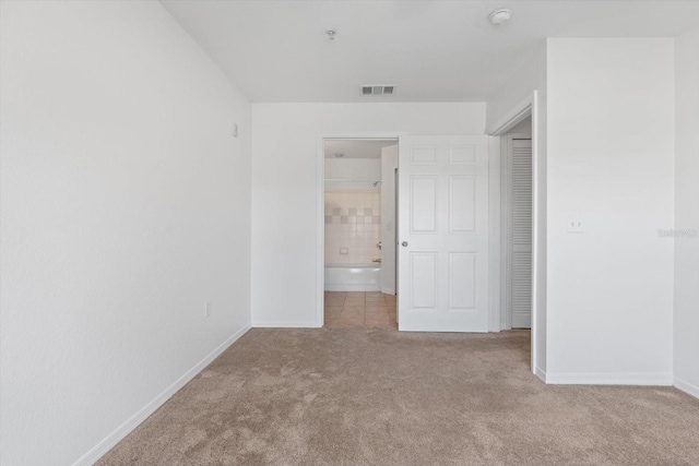 unfurnished bedroom with light carpet