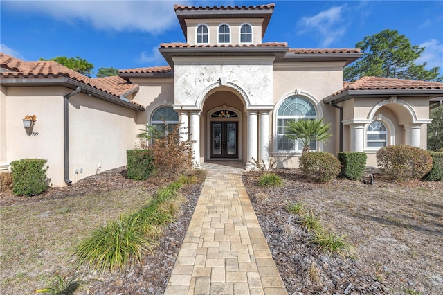 mediterranean / spanish-style home featuring french doors