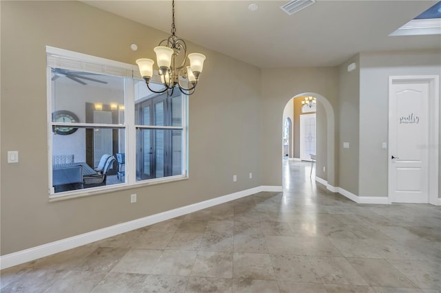 interior space with ceiling fan with notable chandelier