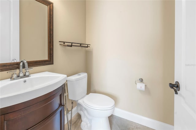 bathroom with tile patterned floors, vanity, and toilet