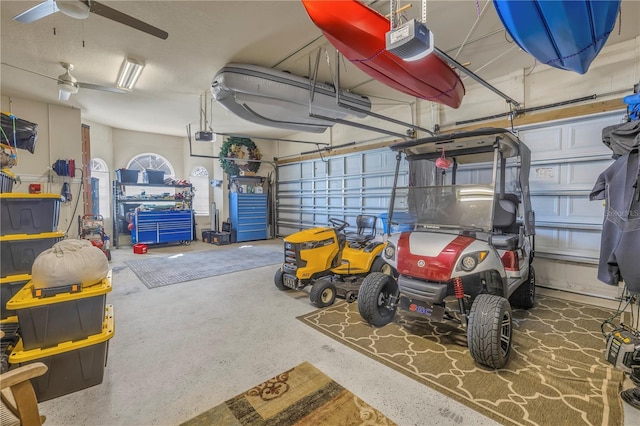 garage with ceiling fan and a garage door opener