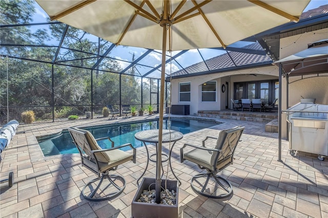 view of pool with a lanai and a patio