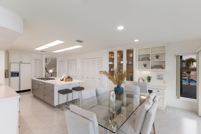 dining area featuring light tile patterned floors