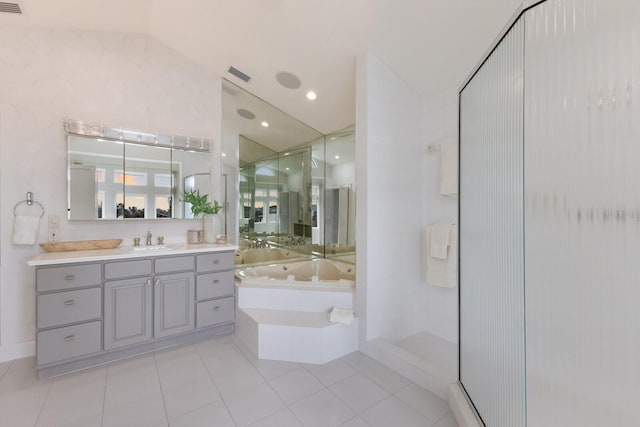 bathroom featuring lofted ceiling, vanity, tile patterned flooring, and separate shower and tub