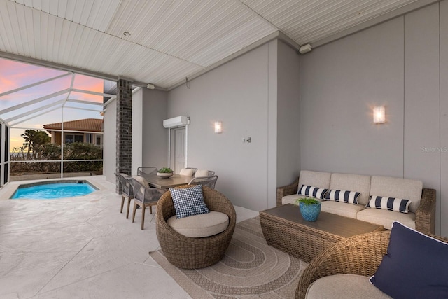 patio terrace at dusk with an outdoor hangout area and glass enclosure