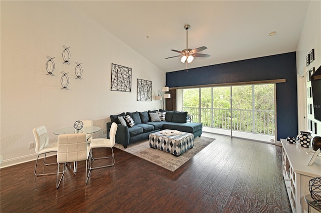 living room with ceiling fan, dark hardwood / wood-style flooring, and high vaulted ceiling