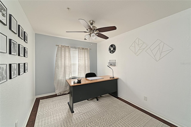 office with hardwood / wood-style floors and ceiling fan