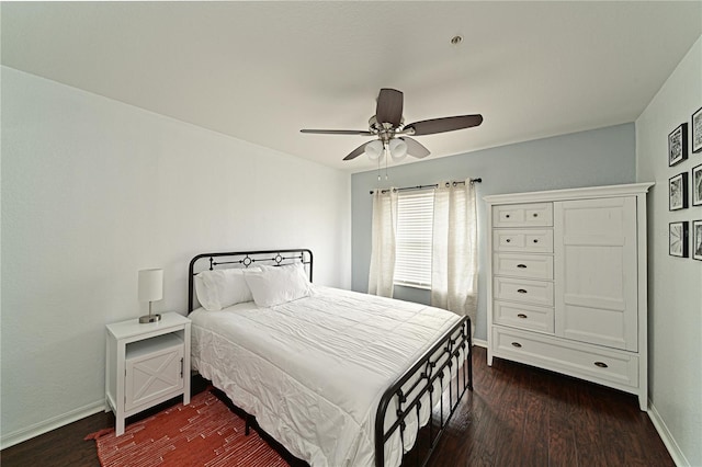 bedroom with dark wood-type flooring and ceiling fan