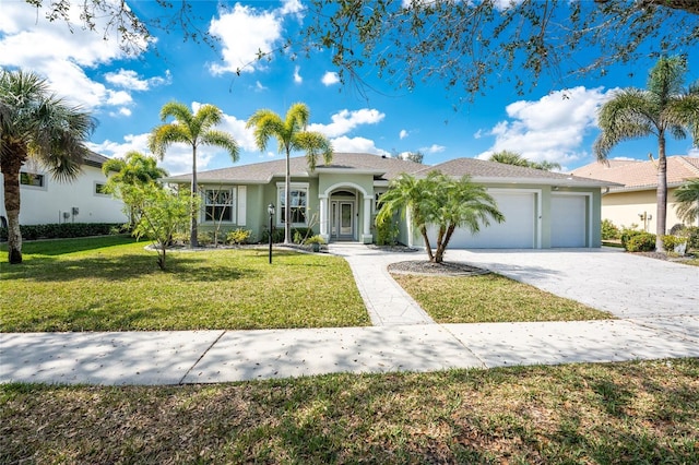 ranch-style house with a garage and a front yard