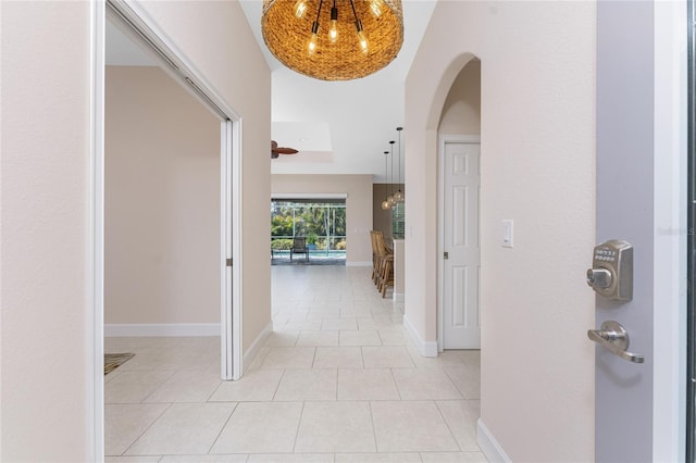 hall with light tile patterned flooring