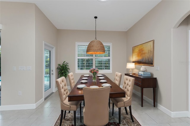 dining space featuring light tile patterned flooring