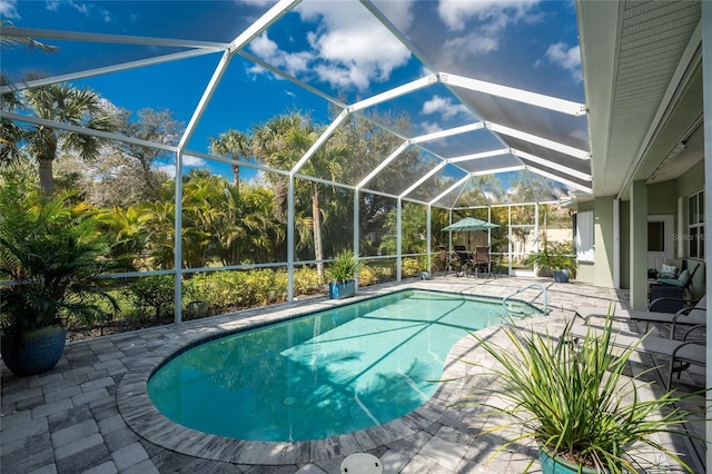 view of pool featuring a lanai and a patio area