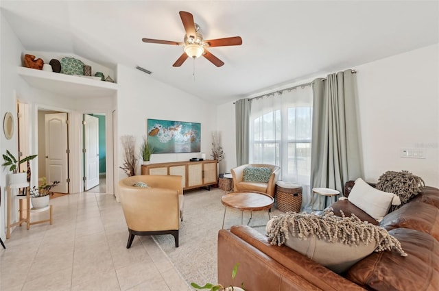 living room with lofted ceiling, light tile patterned floors, and ceiling fan