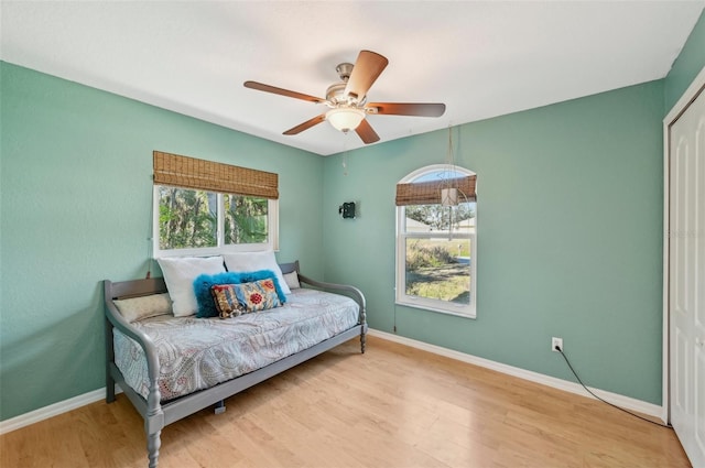 bedroom featuring ceiling fan and light hardwood / wood-style floors