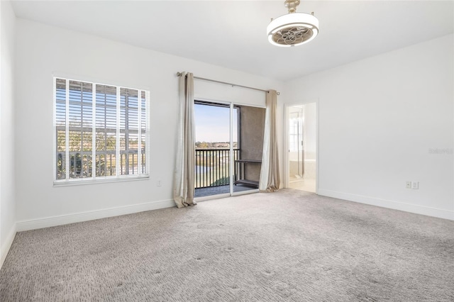 unfurnished room with carpet floors