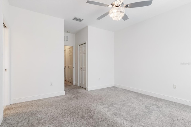 unfurnished bedroom with light colored carpet and ceiling fan