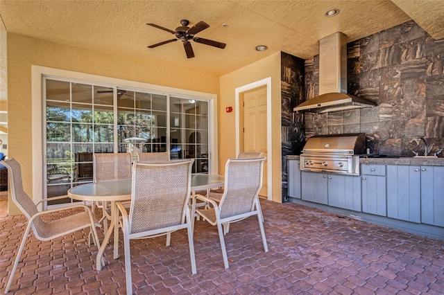 view of patio featuring a grill, area for grilling, and ceiling fan