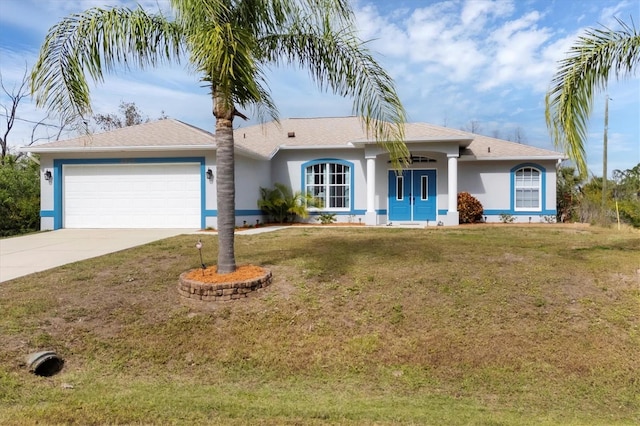 ranch-style house featuring a garage and a front lawn