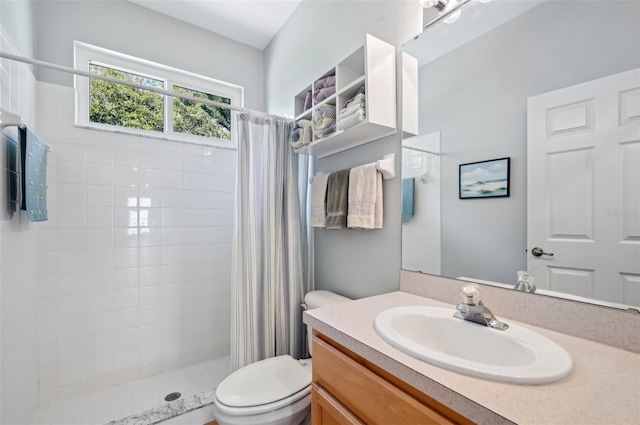 bathroom featuring a shower with curtain, vanity, and toilet