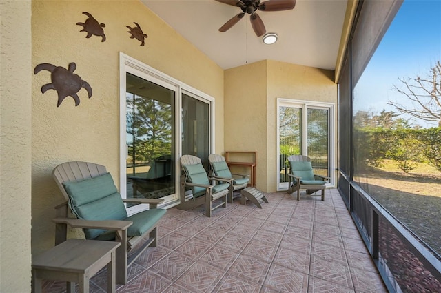 sunroom / solarium with ceiling fan