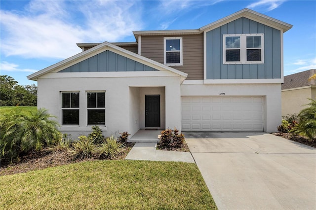 view of front of home with a garage and a front yard