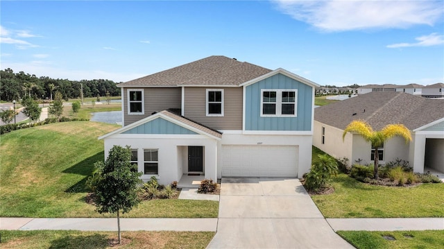 view of front facade featuring a garage and a front yard