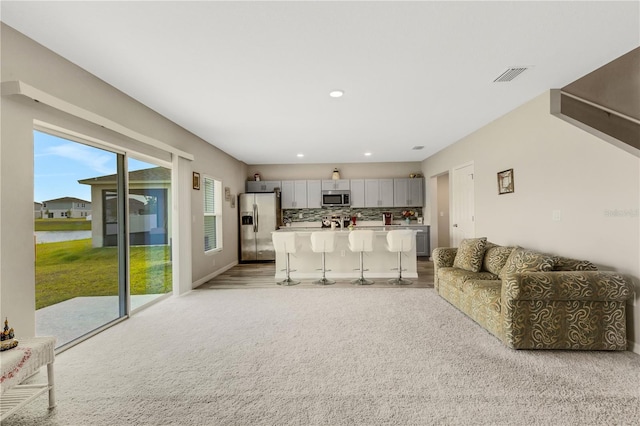 living room with light colored carpet