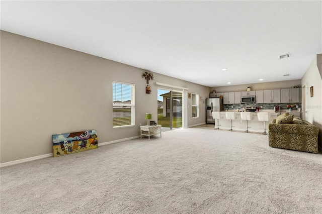 living room featuring light colored carpet