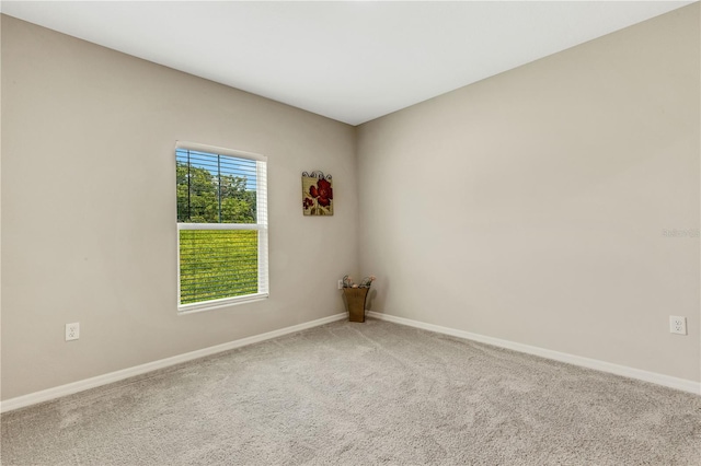 unfurnished room featuring carpet flooring