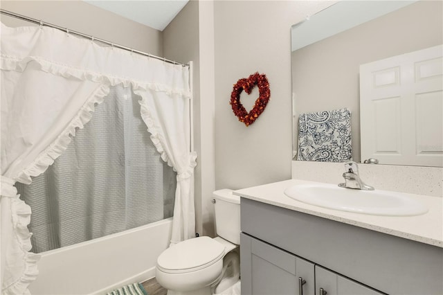 full bathroom with shower / bath combination with curtain, vanity, and toilet