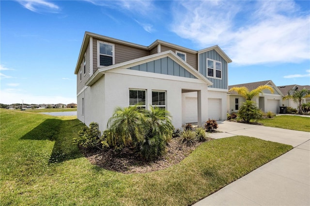 view of front of home with a garage and a front lawn