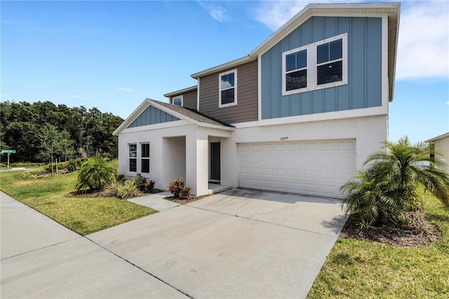 view of front of house featuring a garage and a front lawn