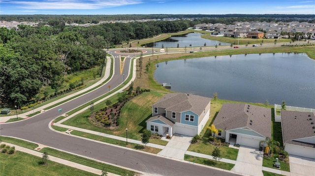 drone / aerial view with a water view