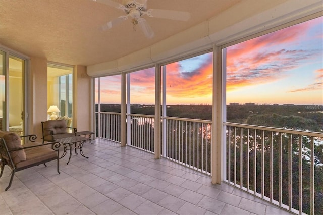 sunroom / solarium with ceiling fan