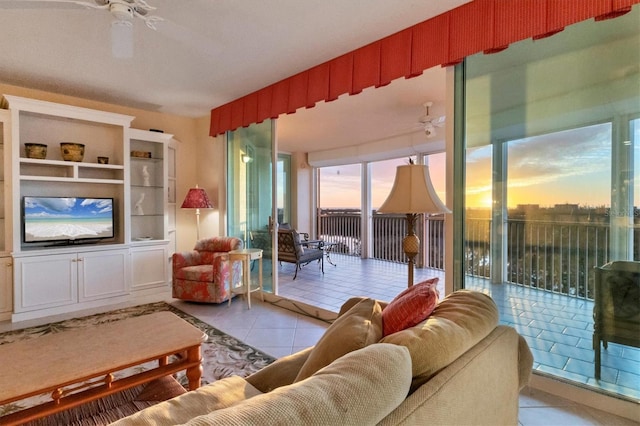 living room featuring light tile patterned flooring and ceiling fan