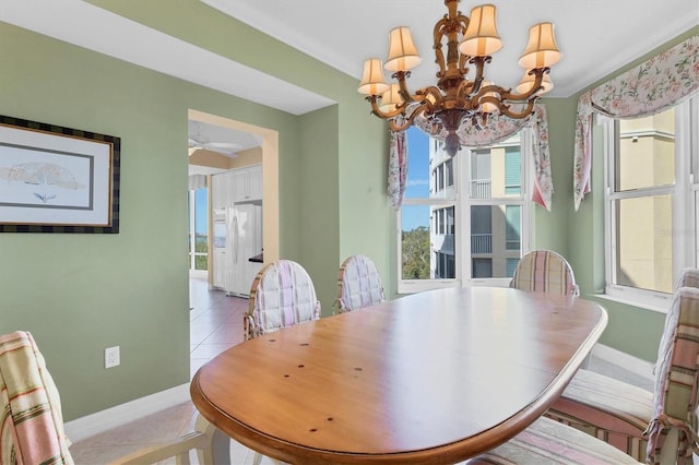 dining room featuring an inviting chandelier and light tile patterned floors