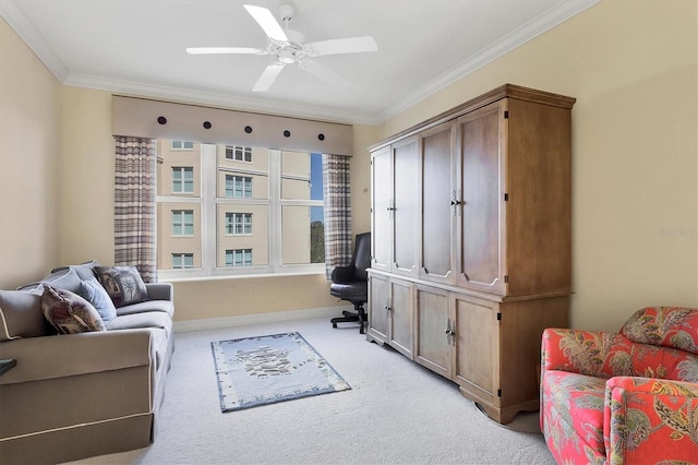 living area featuring ceiling fan, light colored carpet, and ornamental molding