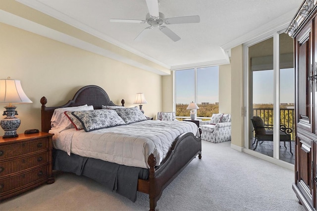 carpeted bedroom featuring crown molding, access to outside, and ceiling fan