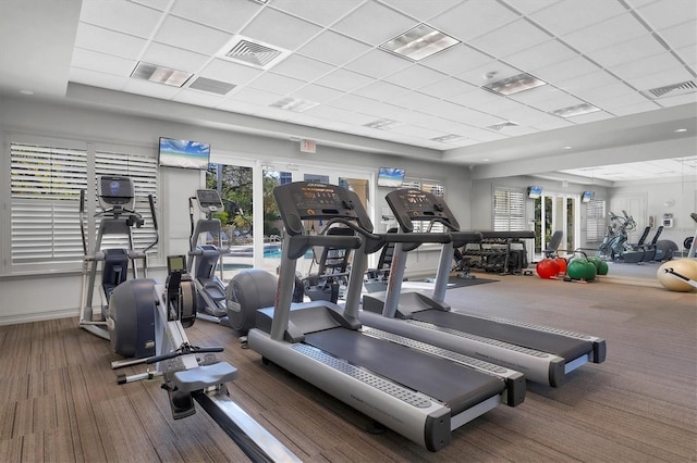 exercise room with a drop ceiling