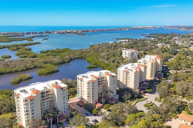 birds eye view of property with a water view