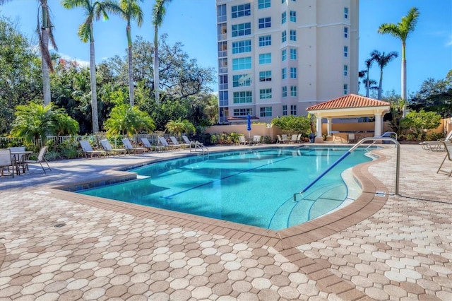 view of swimming pool featuring a gazebo and a patio