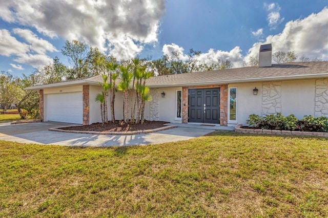 ranch-style home featuring a garage and a front lawn