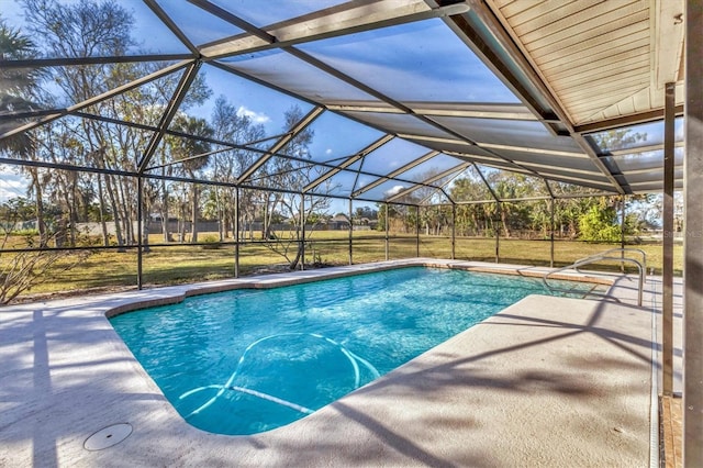 view of swimming pool with a lanai and a patio